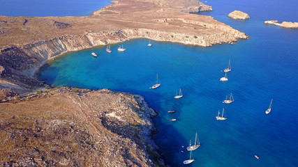 Fototapeta na wymiar Aerial drone photo of famous beach of Lindos with turquoise waters and iconic ancient Acropolis - village of Lindos, Rodos island, Aegean, Dodecanese, Greece