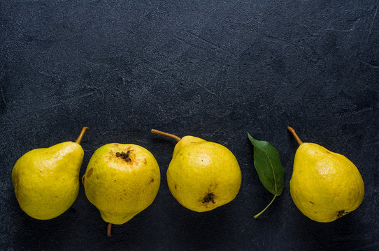 Ripe Yellow Pear On A Dark Background