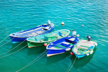 Vibrant small boats in Cantabria with copy space