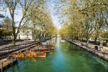 Fototapeta na wymiar View of river and boat from Pont des Amours (Bridge of Love) in Annecy, France