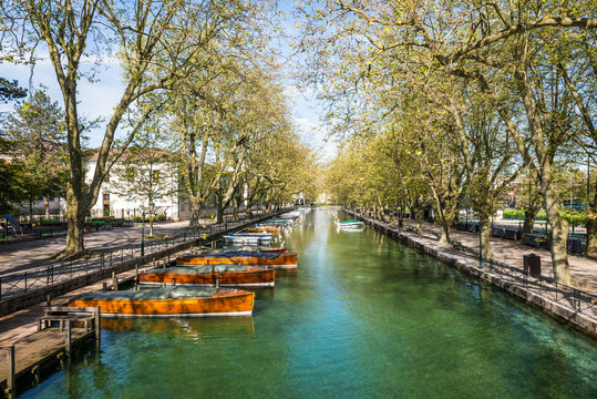 View of river and boat from Pont des Amours (Bridge of Love) in Annecy, France