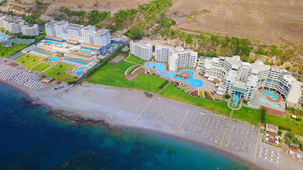 August 2017: Aerial drone photo of famous Kalithea beach seascape with clear waters and 5 star resorts, Faliraki bay, Rodos island, Aegean, Dodecanese, Greece