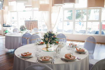Wedding decor. Flowers in the restaurant, table setting