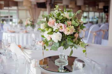 Wedding decor. Flowers in the restaurant, table setting