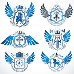 Fototapeta na wymiar Heraldic emblems with wings isolated on white backdrop. Collection of vector symbols in vintage style created using heraldry elements like crowns, towers, crosses and armory.