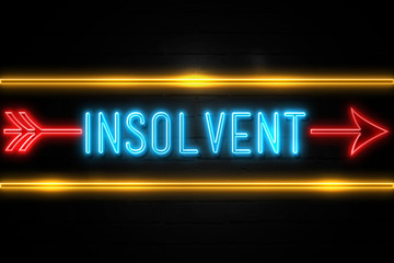 Obraz premium Insolvent - fluorescent Neon Sign on brickwall Front view