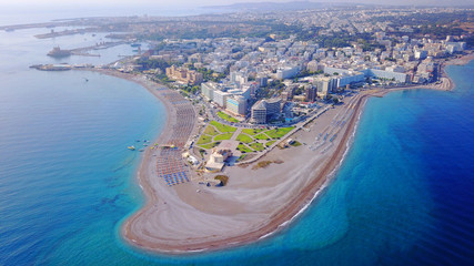 August 2017: Aerial drone photo of Rodos town peninsula with famous resorts and turquoise clear...
