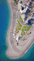 August 2017: Aerial drone photo of Rodos town peninsula with famous resorts and turquoise clear...