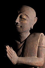Fototapeta na wymiar Buddhist monk in serene prayer pose.