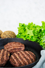Ingredients for burger. Beef meat cooked on the grill
