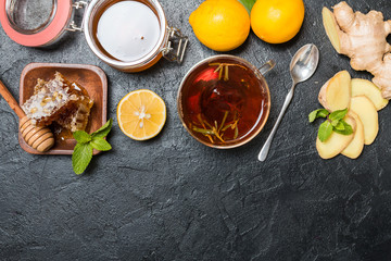 Fototapeta na wymiar Cup of ginger tea with lemon and honey