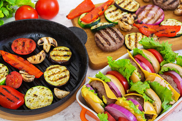 Grilled vegetables and handmade burger. Zucchini, eggplant, mushrooms, pepper on the grill. Top view