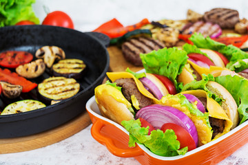 Grilled vegetables and handmade burger. Zucchini, eggplant, mushrooms, pepper on the grill. Top view