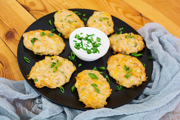 Chicken schnitzels on wooden background