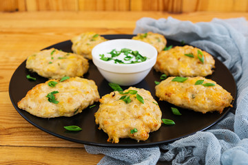 Chicken schnitzels on wooden background. Top view