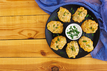 Chicken schnitzels on wooden background. Top view