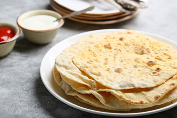 Fresh pitas on plate
