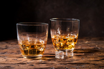 Whiskey with ice in glasses
