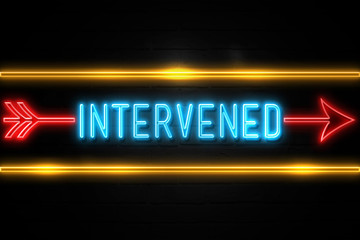 Obraz premium Intervened - fluorescent Neon Sign on brickwall Front view