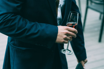 person holding a glass of champagne or wine