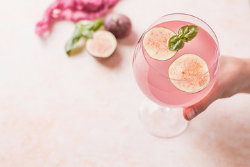 Pink cocktail with fig