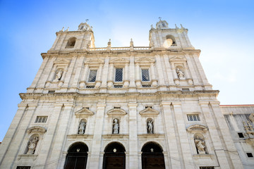 Fototapeta na wymiar Main facade of Monastery of Sao Vicente de Fora in Alfama, Lisbon, one of the most important monasteries in the country. The monastery contains the royal pantheon of the Braganza monarchs of Portugal.