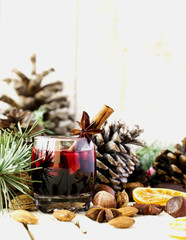 New Year or Christmas composition with walnuts, mulled wine, hazelnuts