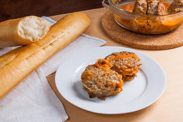 Homemade meatballs roasted with vegitables in ceramic bowl, classic recipe.