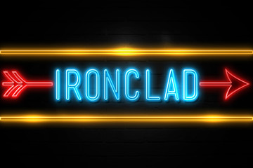 Obraz premium Ironclad - fluorescent Neon Sign on brickwall Front view