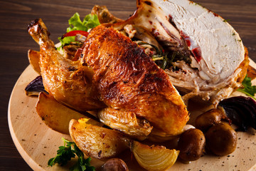 Roast chicken on cutting board 