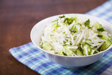 Salad with kohlrabi, cucumber and dill.