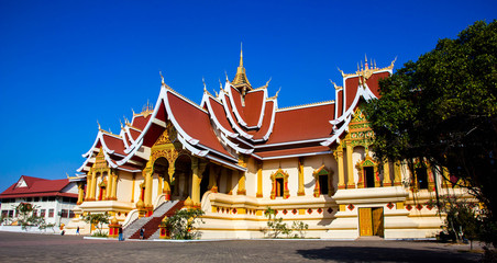Temple and blue sky in Laos, texture background, Wat That Luang Neua, Laos