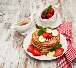 Pancakes with strawberries and bananas