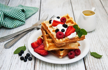 waffles with strawberries,  blueberry and sauce