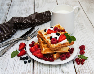 waffles with strawberries,  blueberry and milk