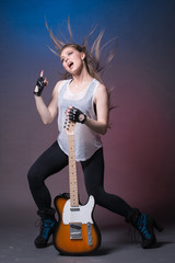 Girl with guitar at the rehearsal before the performance