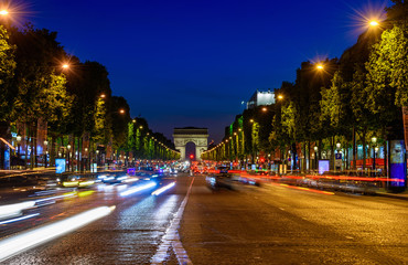 Champs-Elysees and Arc de Triomphe at night in Paris, France