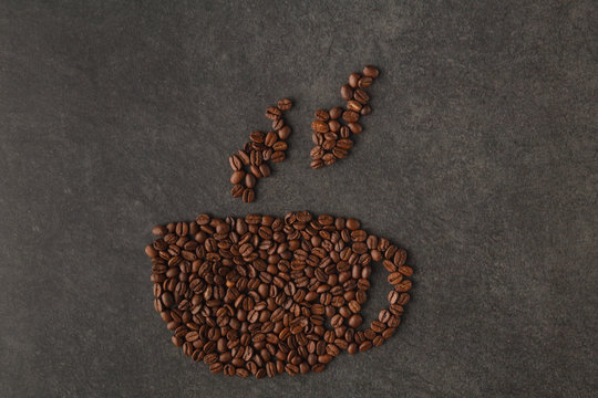 Creative still life of a cup image made of coffee beans