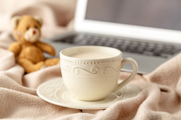 Hot coffee and book on wool background - seasonal relax concept