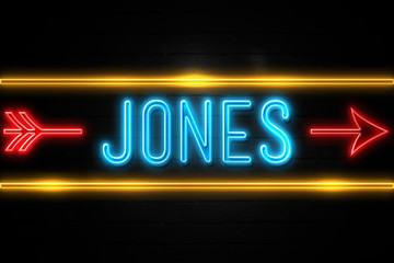 Jones  - fluorescent Neon Sign on brickwall Front view - obrazy, fototapety, plakaty