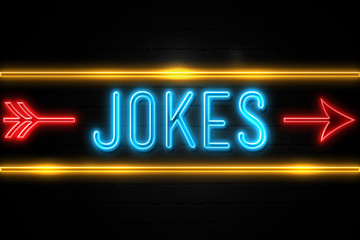 Jokes  - fluorescent Neon Sign on brickwall Front view