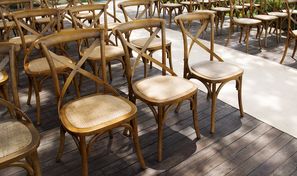 Wooden chairs set row orderly on the terrace.