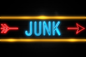 Junk  - fluorescent Neon Sign on brickwall Front view
