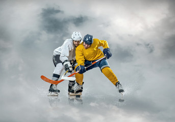 Ice hockey player in action outdoor around mountains