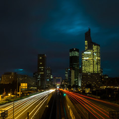 Fototapeta na wymiar Modern city at night with cars light lines.