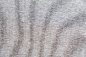 Grey heather texture. Grey fabric texture. Background with delicate striped pattern. Real heather grey knitted fabric made of synthetic fibres textured background.