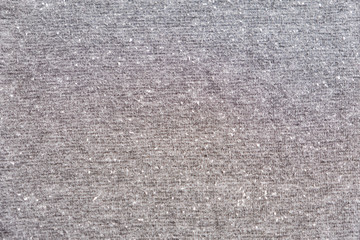 Grey heather texture. Grey fabric texture. Background with delicate striped pattern. Real heather grey knitted fabric made of synthetic fibres textured background.
