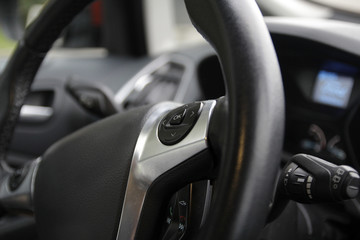 Fototapeta na wymiar OK button on the steering wheel of the car
