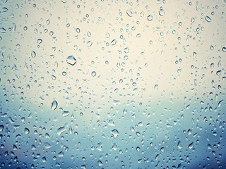 Rain in city, water drops on wet window glass - 170427191