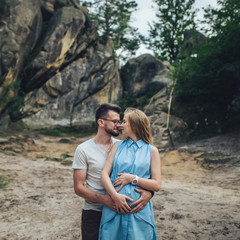 Lovely wedding couple against rocks of fortess  at Carpathian mountains.